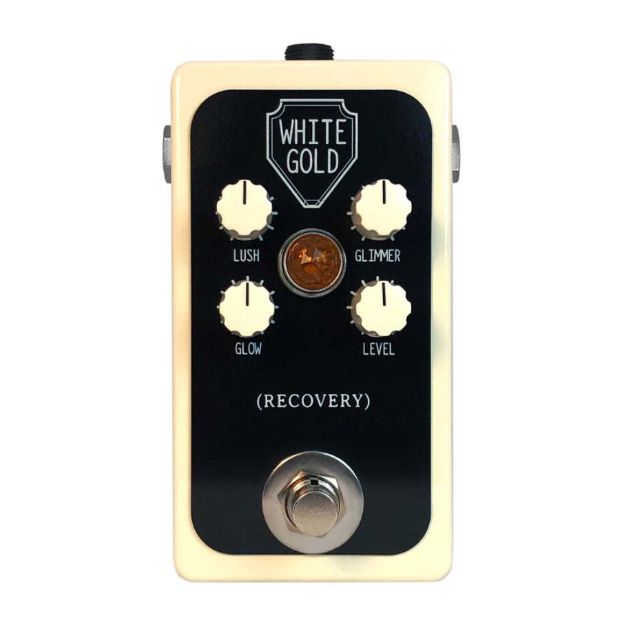 Rectangular guitar effects pedal with four knobs, an amber indicator light, and a footswitch on a cream and black face.