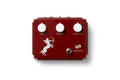 Red overdrive pedal with three white knobs labeled Gain, Treble, Output, a footswitch, and centaur graphic.