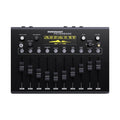 Black audio equipment panel with sliders and knobs labeled with frequencies and filter controls, featuring a digital display.