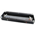 Rectangular black metal reverberation tank with wires and multiple connectors on the sides.