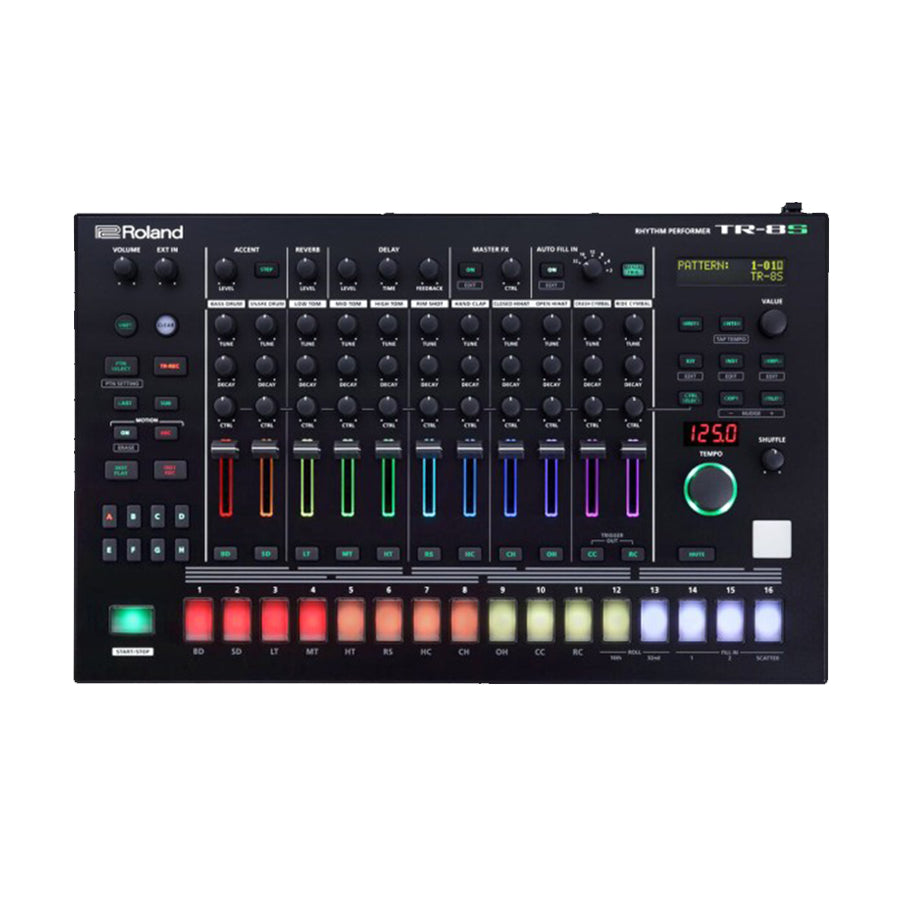 Black drum machine with colored lit pads, knobs, sliders, and a digital display showing pattern and tempo.