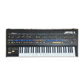 Black synthesizer keyboard with multiple knobs, sliders, buttons, and two pitch/modulation wheels on the left side.