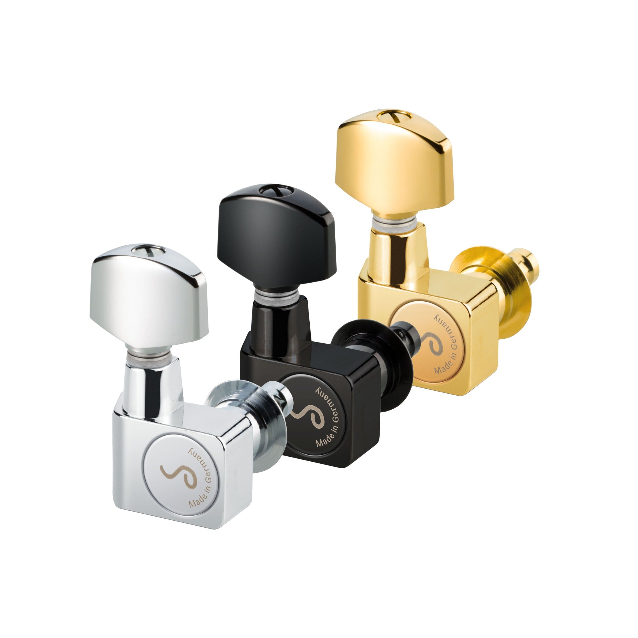 Three guitar tuning pegs in silver, black, and gold colors arranged together on white background.