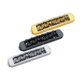 Three metal guitar bridges in gold, black, and silver finishes displayed on a white background.