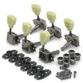 Set of six guitar tuning pegs with cream knobs, mounting hardware, and bushings on a white background.