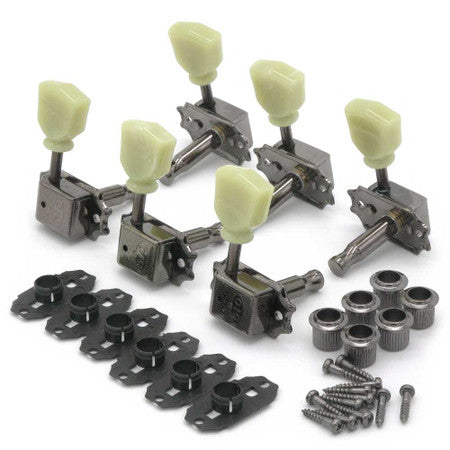 Set of six guitar tuning pegs with cream knobs, mounting hardware, and bushings on a white background.