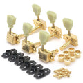 Set of gold guitar tuning pegs with cream knobs, black mounting brackets, and gold screws arranged on a white background.