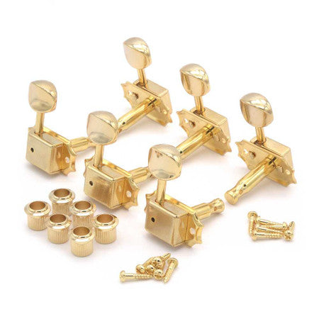 Six gold guitar tuning pegs with housings, six bushings, and screws arranged on a white background.