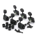 Set of six black guitar tuning pegs with bushings and screws on a white background.