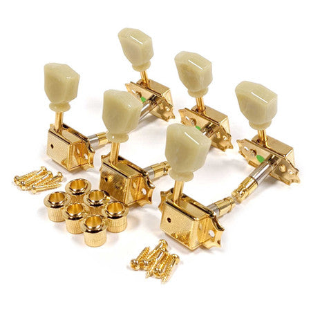 Set of six gold guitar tuners with cream plastic tuning knobs and mounting screws.
