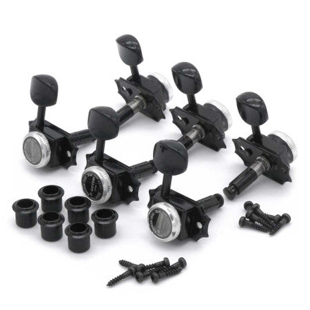Set of six black guitar locking tuners with matching bushings and mounting screws arranged on a white surface.