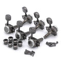 Set of six black metal guitar locking tuners with screws and bushings visible on white background