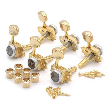 Set of four gold guitar tuning machines with mounting bushings and screws on a white background.