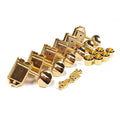 Set of six gold guitar tuning pegs with accompanying bushings and screws on a white background.