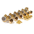 Set of six gold guitar locking tuners with mounting screws and bushings on a white background.