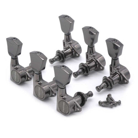 Set of six metal guitar tuning pegs in black finish with accompanying screws on white background.