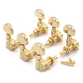 Set of six gold-colored guitar tuning pegs with screws on a white background.