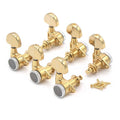 Set of six gold locking tuning machines for guitar with mounting screws on white background