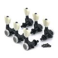 Set of six black guitar tuning pegs with white knobs and accompanying screws on white background.