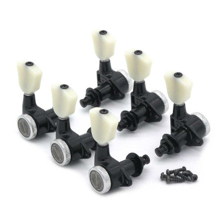 Set of six black guitar tuning pegs with white knobs and accompanying screws on white background.