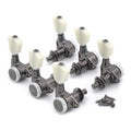 Set of five Gotoh locking tuning machines with white tuning keys and mounting screws on white background.