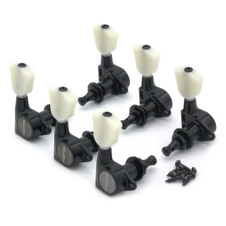 Set of six black guitar machine heads with white tuning knobs and a small pile of screws.