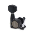 Single black guitar tuning machine with metal casing and one small screw beside it.