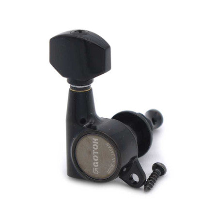 Single black guitar tuning machine with metal casing and one small screw beside it.