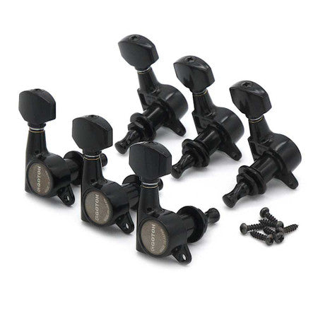 Six black guitar tuning machine heads with screws arranged on a white background.