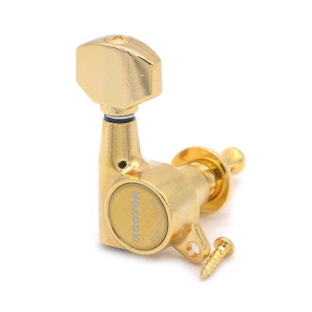 Gold individual guitar tuning machine tuner with mounting screw on white background.