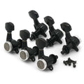 Set of six black guitar locking tuners with silver circular knobs and six black screws on white background