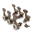 Set of six metallic tuning pegs for a guitar with six screws on a white background.