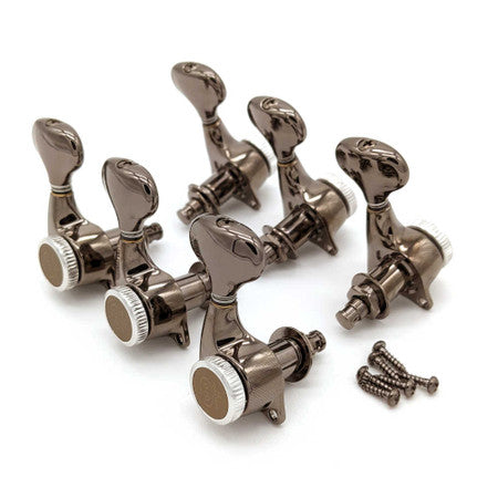 Set of six metallic tuning pegs for a guitar with six screws on a white background.