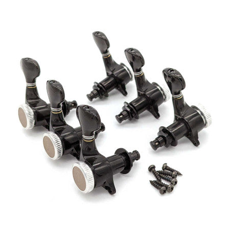 Set of six black locking guitar tuners with silver tuning knobs and included mounting screws.