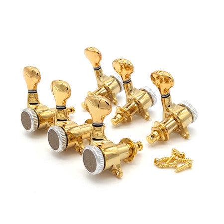Set of six gold locking guitar tuners with mounting screws laid out on a white background.