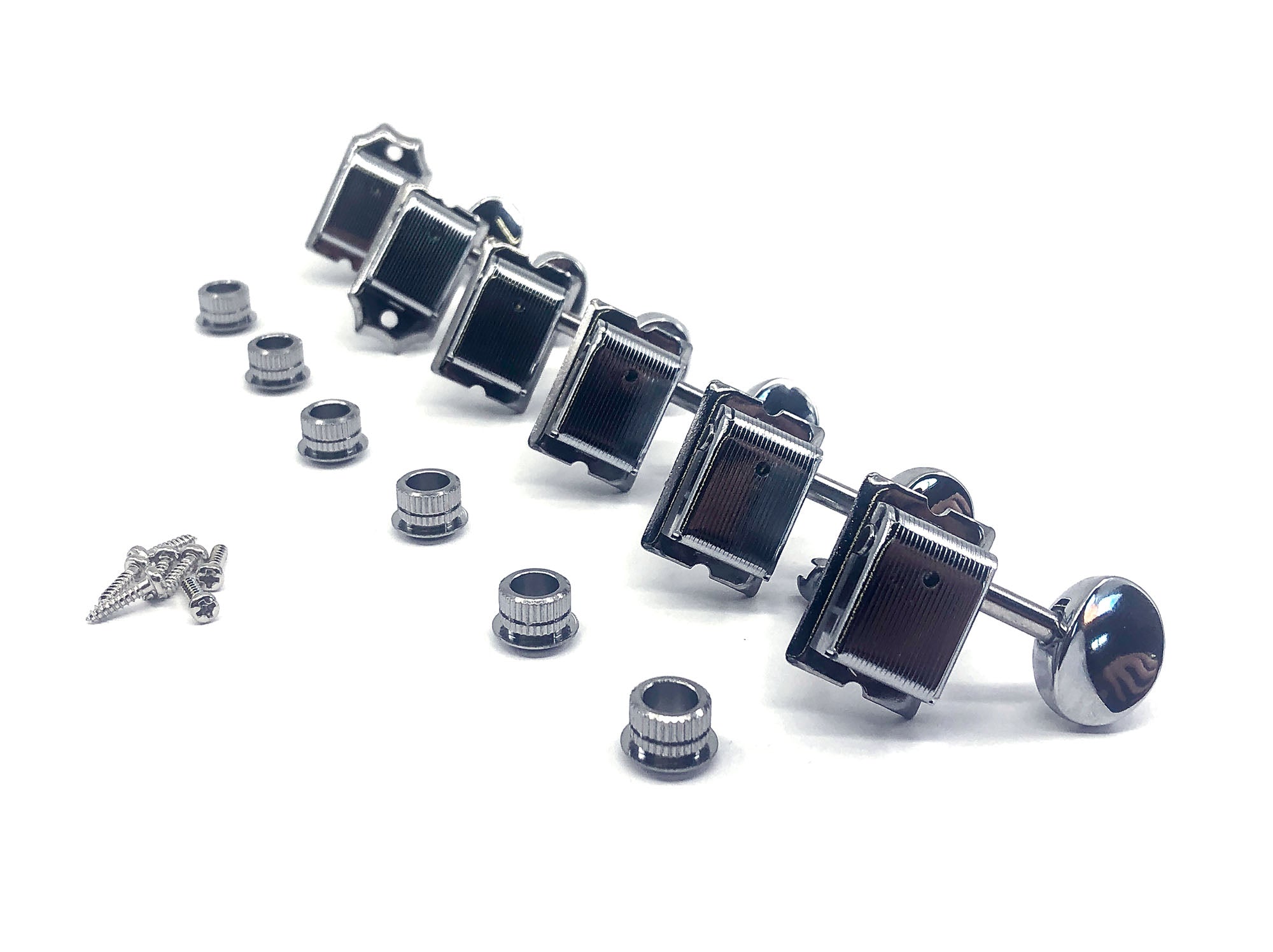 Set of six inline chrome guitar machine heads with oval buttons and included bushings and screws on white background.