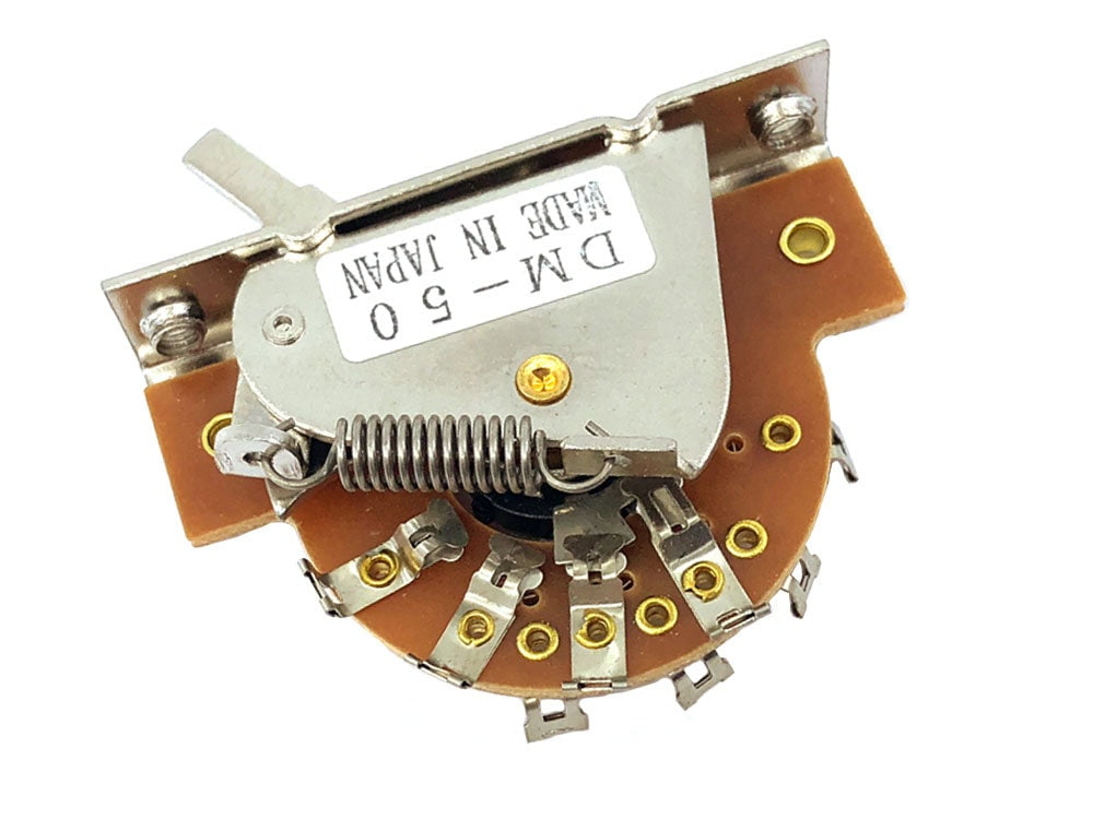 5-way selector switch component with metal lever and multiple soldering tabs on a brown circuit board