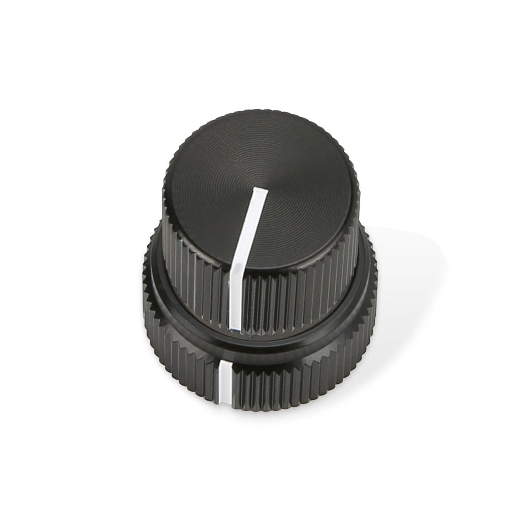 Black dual concentric knob with white indicator lines on each knob tier.