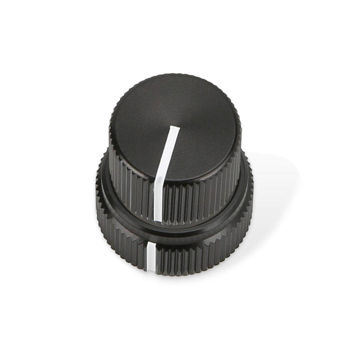 Black dual concentric knob with white indicator lines on each knob tier.