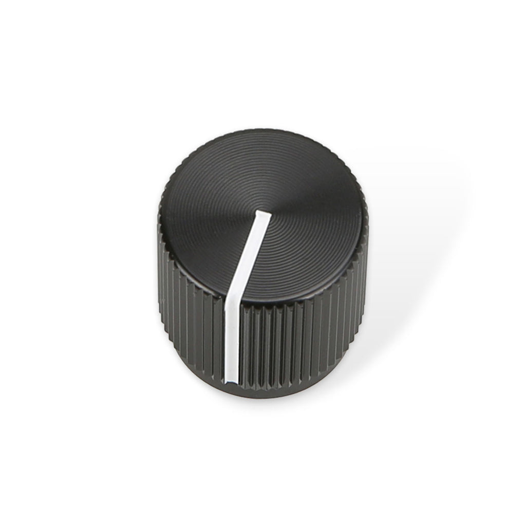 Black round rotary knob with ridged sides and a white indicator line on top on a white background.