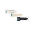 Three bridge pins for stringed instruments in white, beige, and black with blue abalone inlay dots on top.