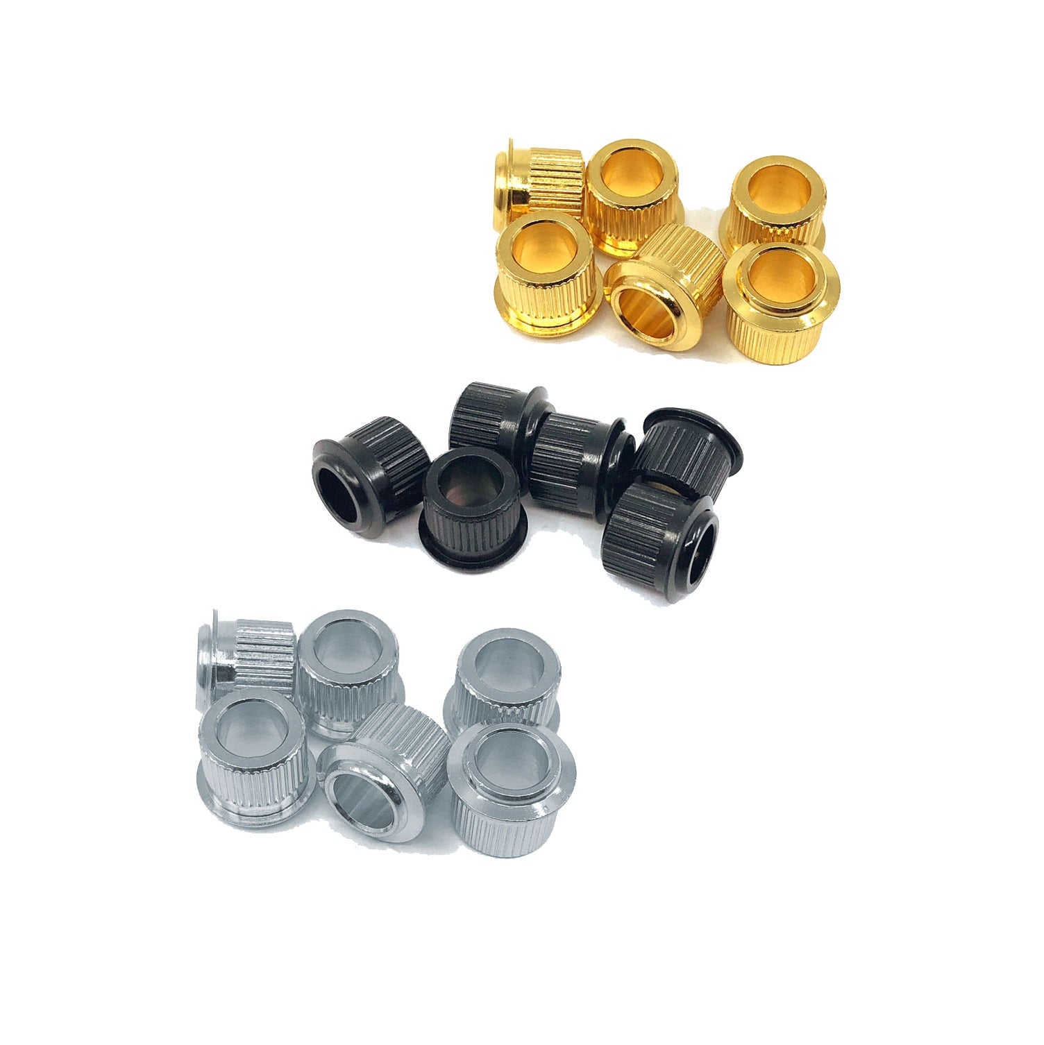 Three sets of metallic bushings in gold, black, and silver colors arranged on a white background.