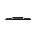 A black classical guitar bridge with a natural wood accent strip and six string holes.