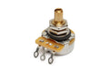 Gold knurled shaft potentiometer with three solder lug connectors on a beige base.