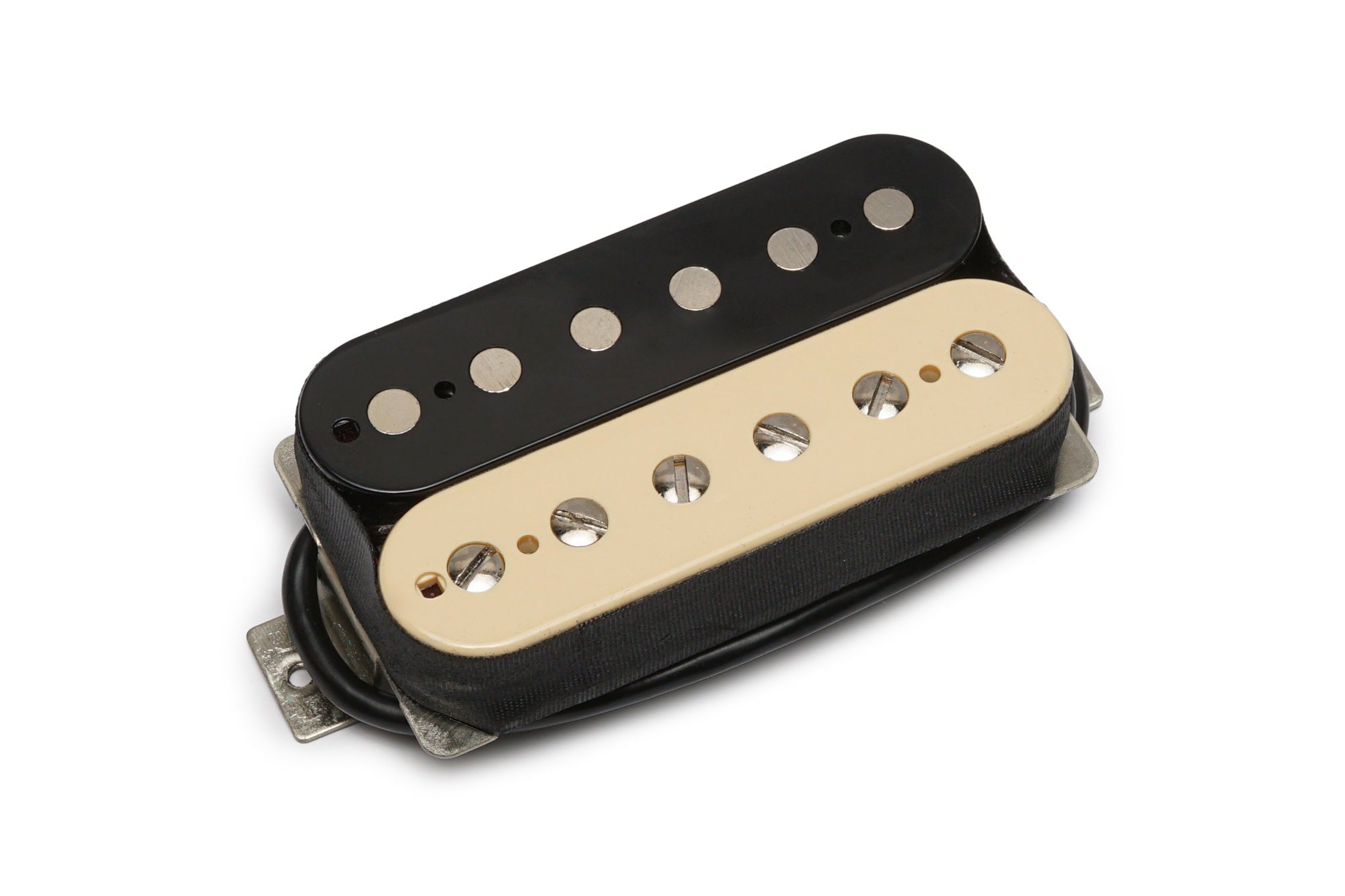 A dual-coil humbucker guitar pickup with one black and one cream coil and attached wiring on white background.
