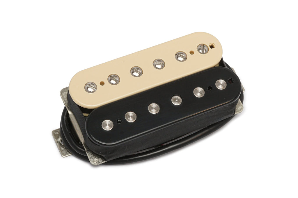 A cream and black humbucker guitar pickup with visible pole pieces and adjustment screws on a white background.