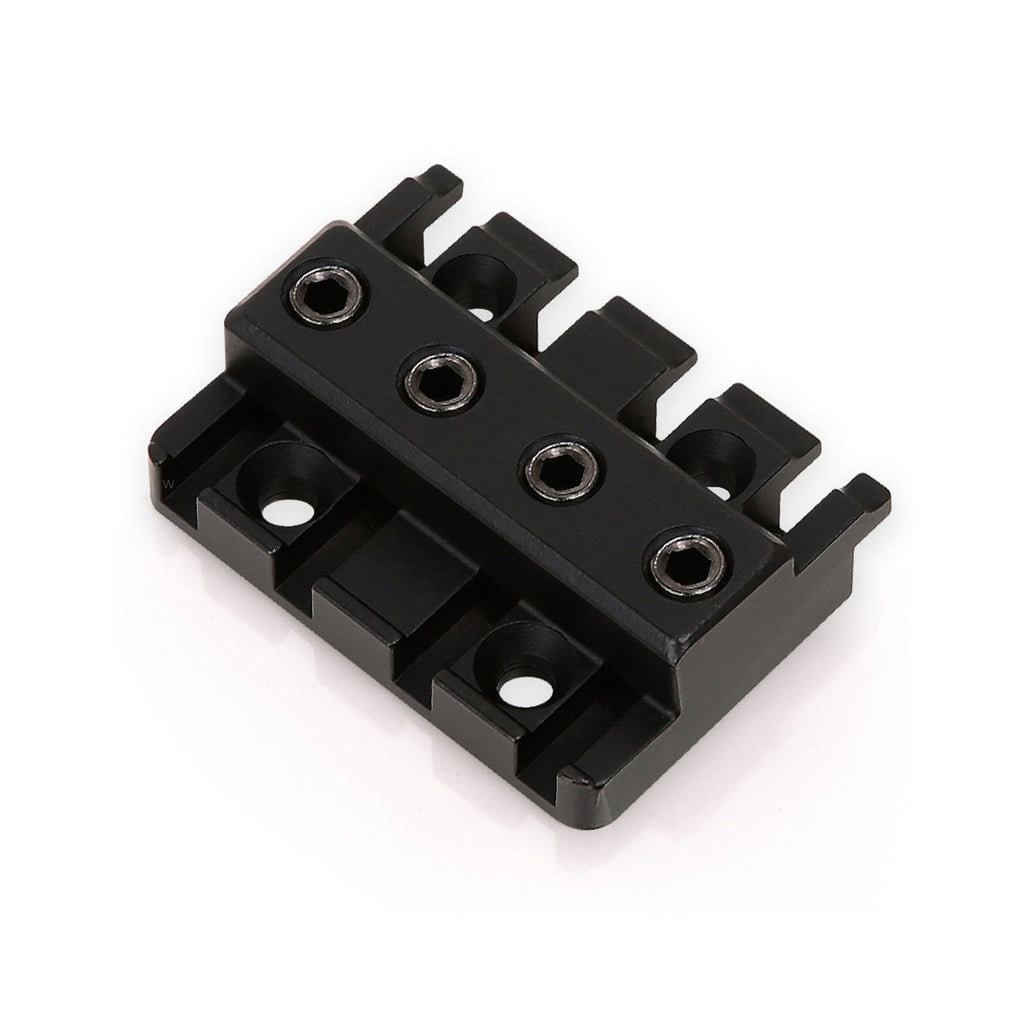 Black metal part with four hex screws and four slots, likely a component for a stringed instrument.