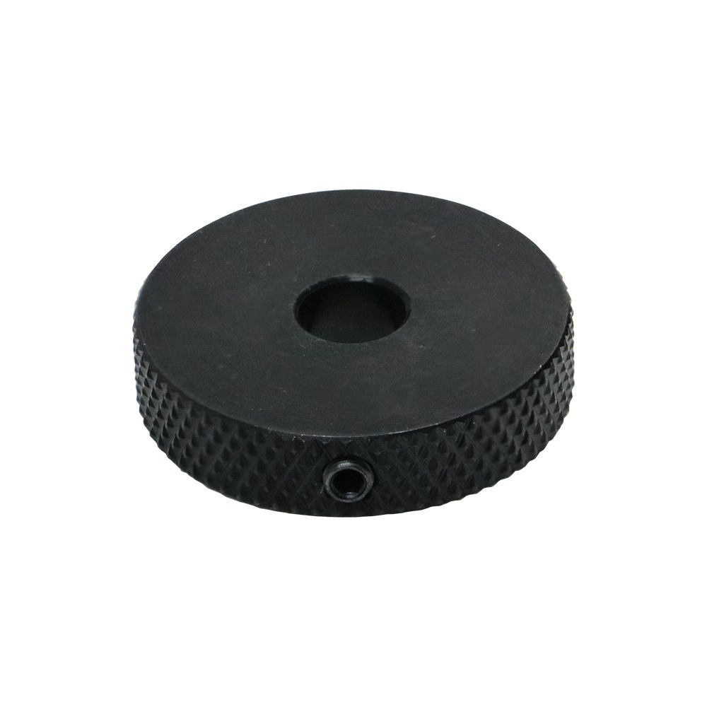 Black round knurled control wheel with a center hole and side set screw
