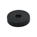 Black round knurled control wheel with a center hole and side set screw