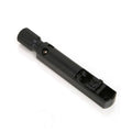Close-up image of a black metal bass bridge saddle with a knurled adjustment knob.